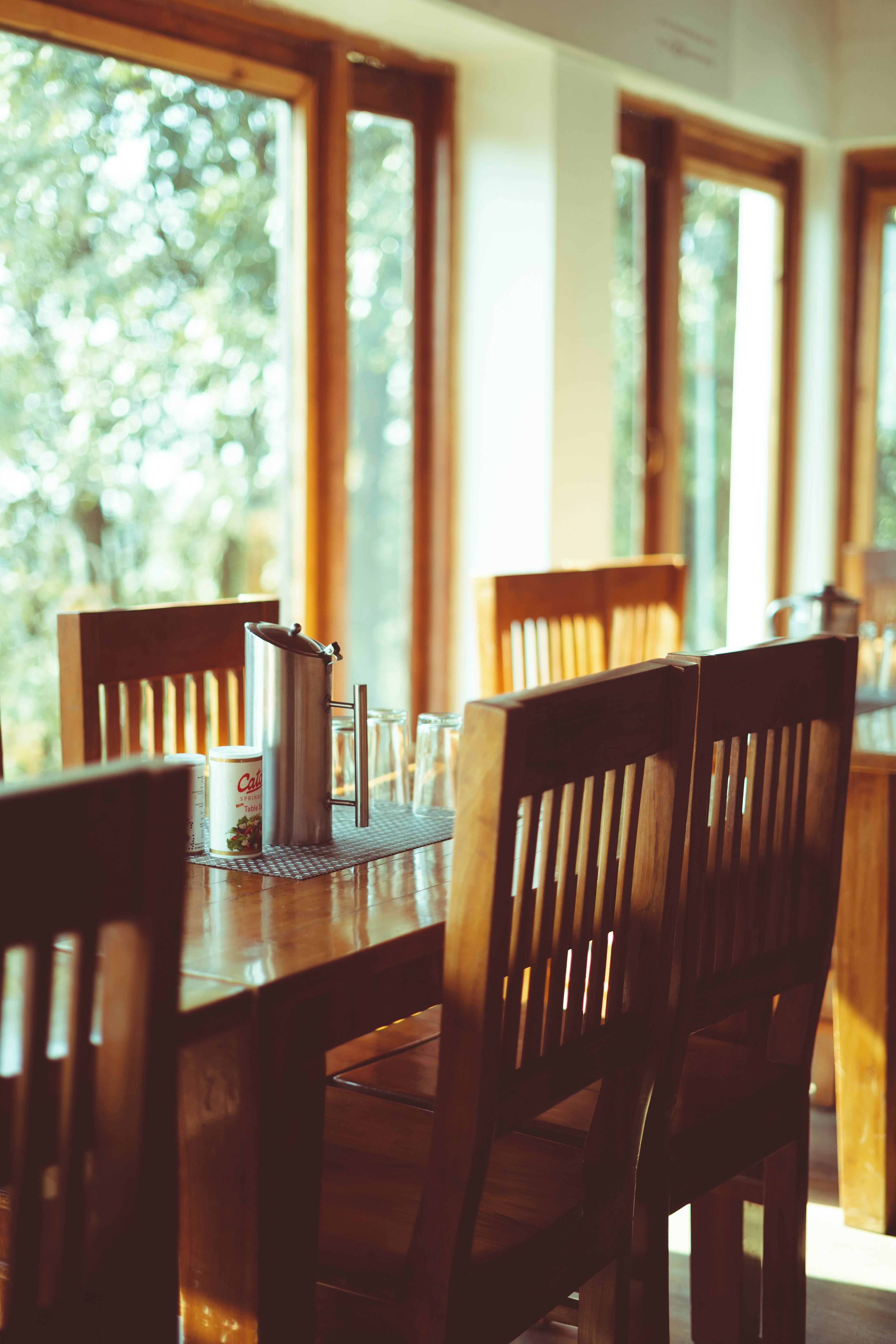 brown wooden dining table with chairs